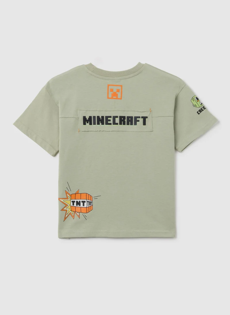 او في اس تيشيرت قطن أوفيس للأطفال بقصة عادية وطبعة زاحف أخضر